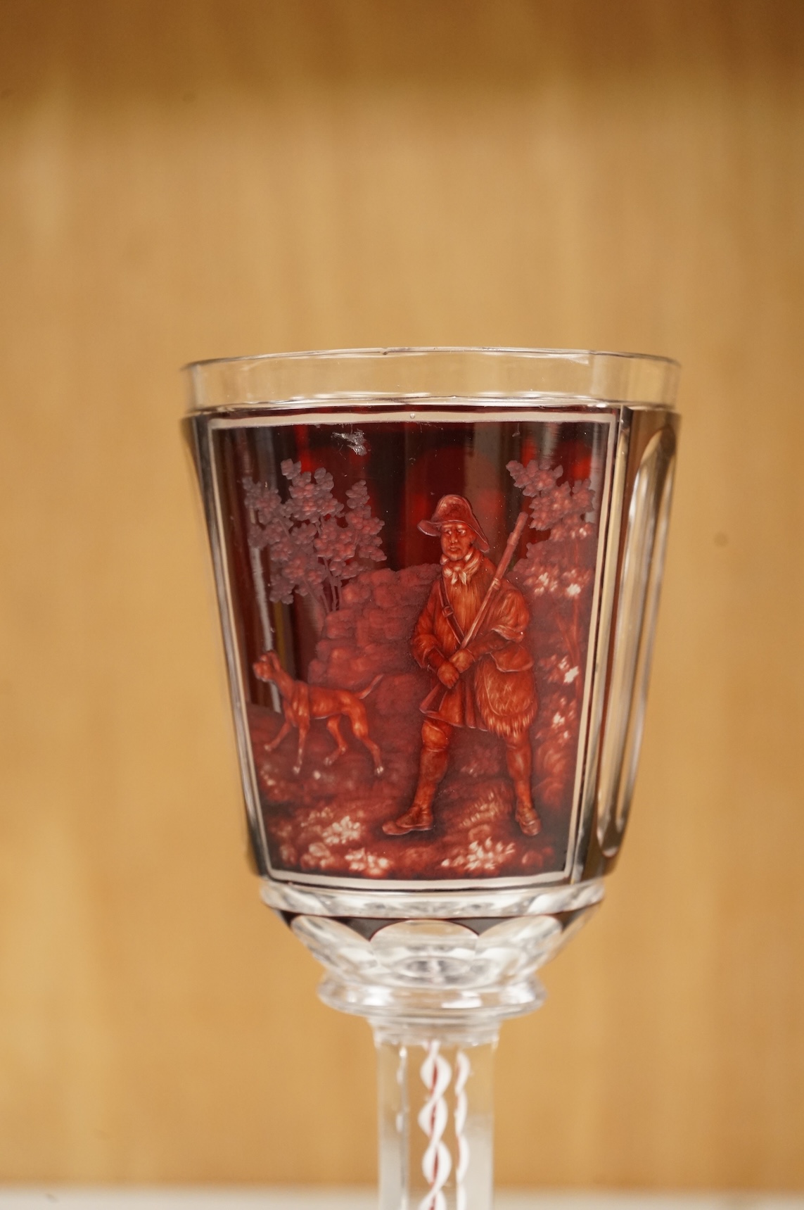 A Bohemian engraved ruby overlaid wine goblet, c.1850